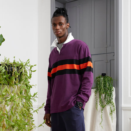 Model wearing Admiral Rendell Men's Rugby Shirt - Claret Plum with Band Stripe